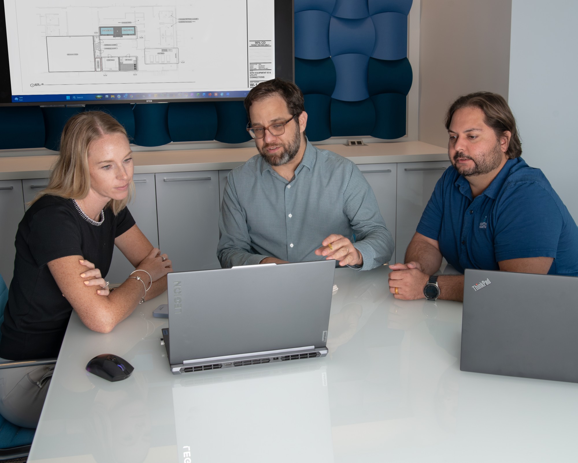 Martin Aquatic engineers reviewing site equipment drawings on a laptop