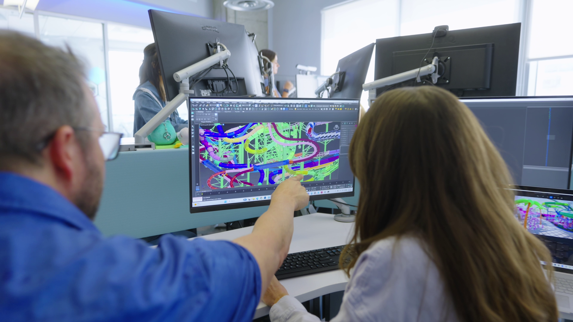 Ectovox designers reviewing a 3D model at a workstation