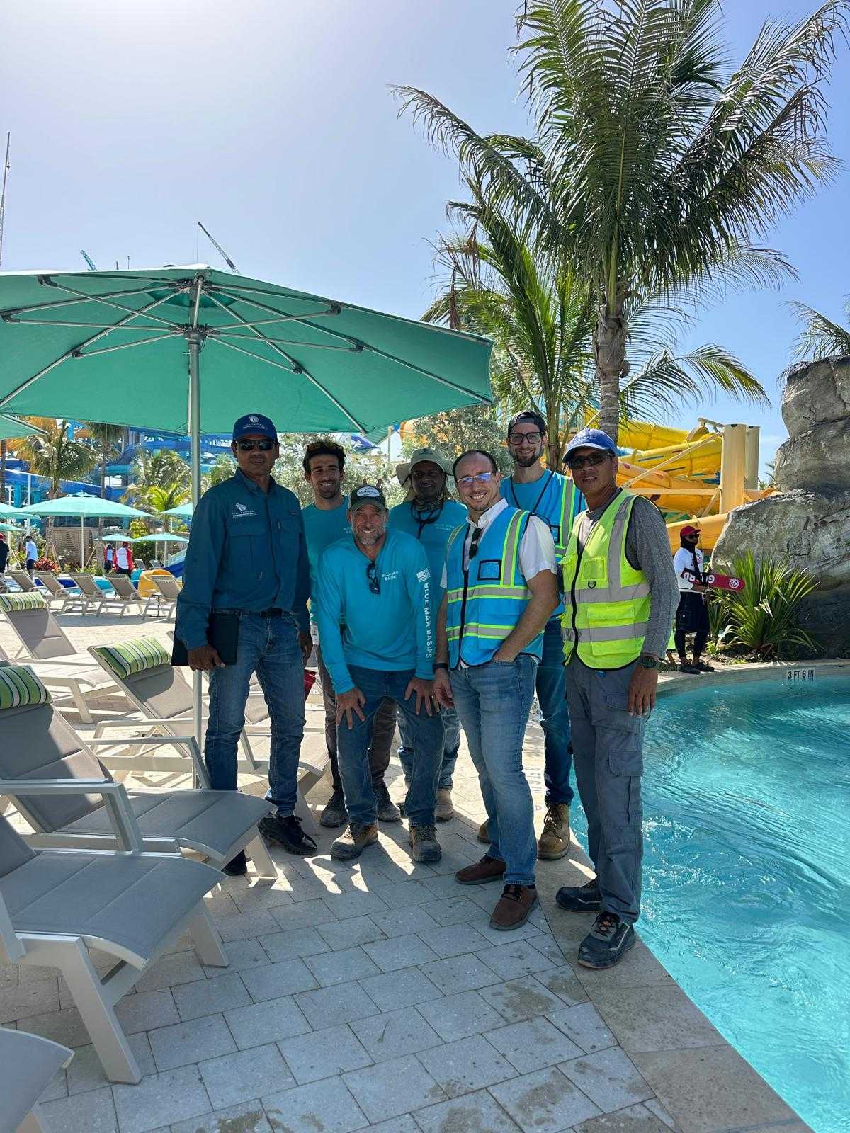 Martin Aquatic team on site beside a pool