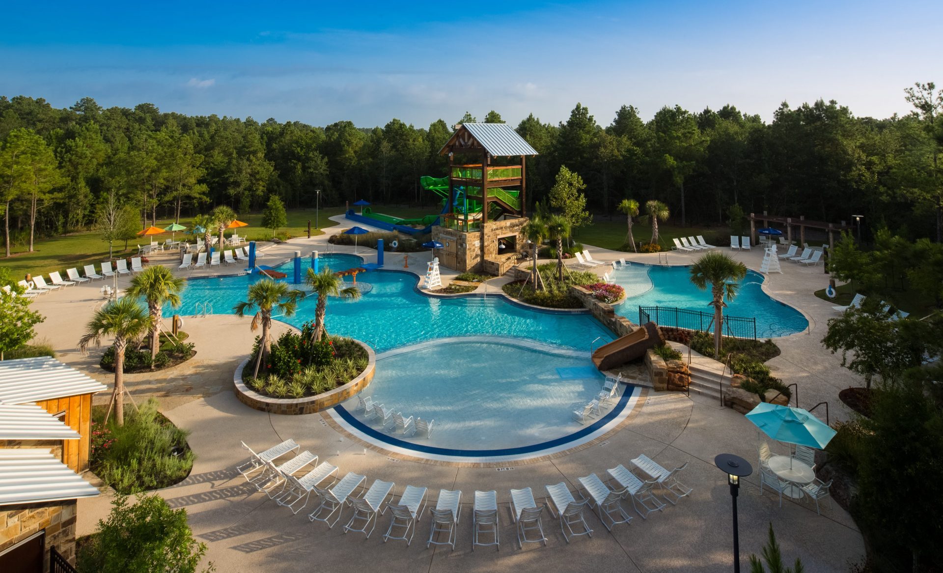Woodforest Forest Island Pool complex designed by Martin Aquatic offers lounge seating