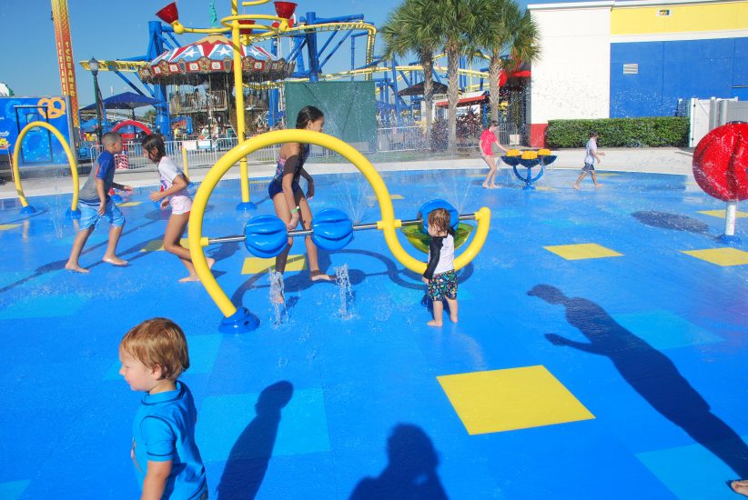 Youth playing with interactive water features at Fun Spot America