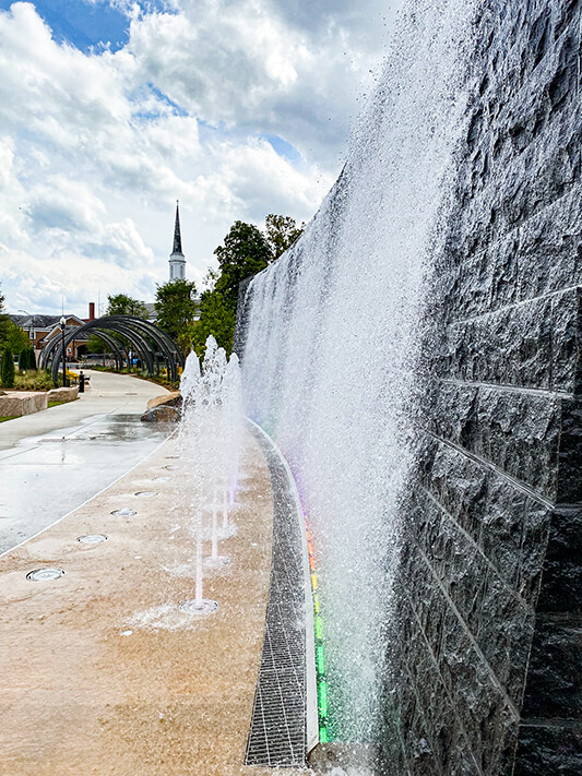 Waterfall wall at Bell Tower Green in the daylight
