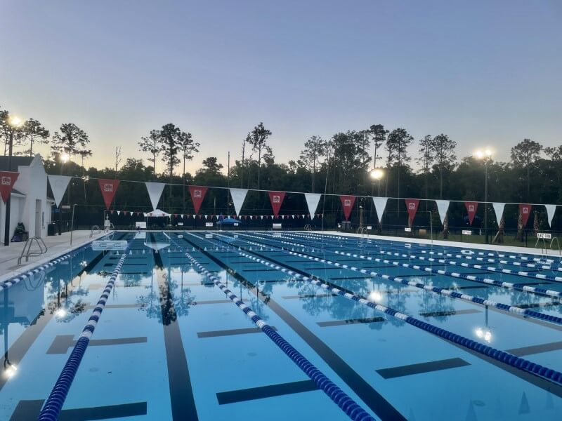 Planet Swim Aquatics competition pool after sunset