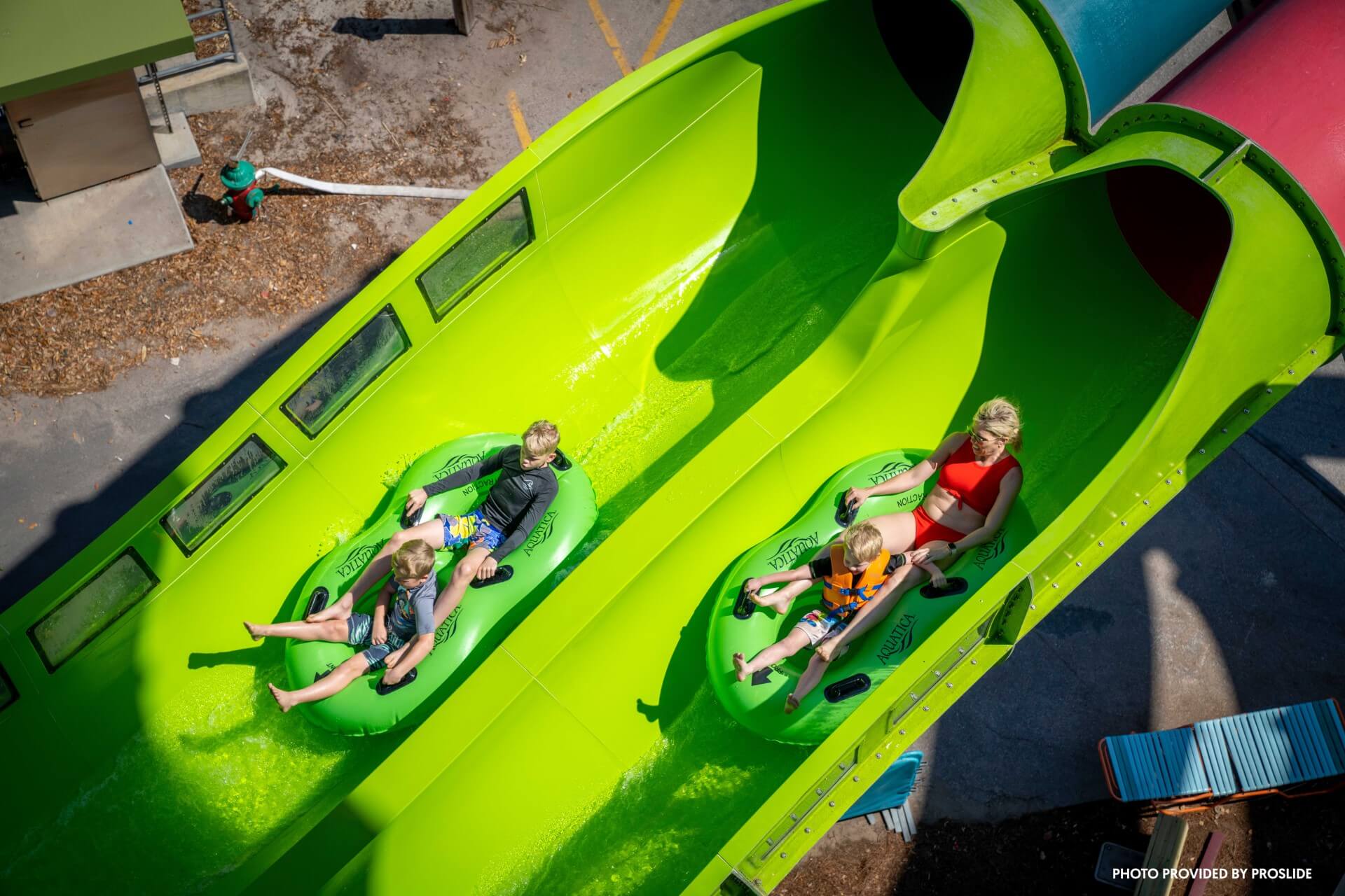 Riders slide side by side on SeaWorld Aquatica Riptide Race