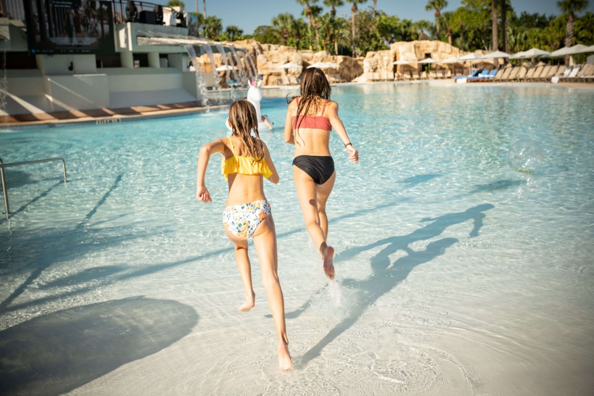 Youth playing in Orlando World Center Marriott's Falls Oasis Pool