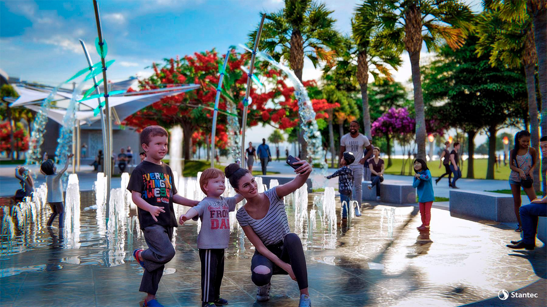 Family playing with Imagine Clearwater at Coachman Park's interactive water features